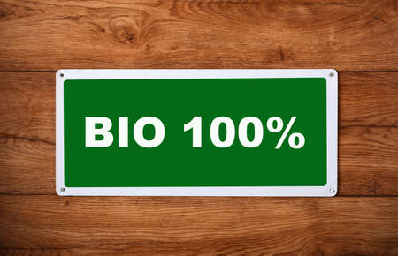 plaque with the inscription bio 100 % on the wooden wallの写真素材