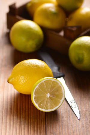 yellow lemon cut on the wooden tableの写真素材