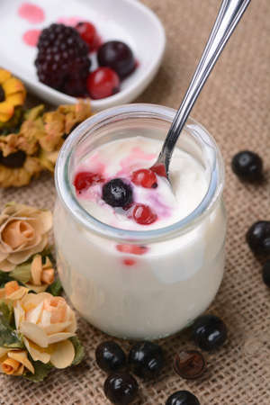yoghurt with soft fruits in glass jar