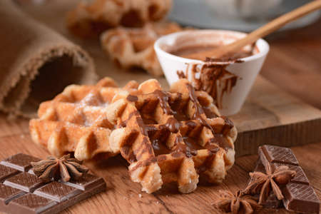 waffles with chocolate with ingredients aroundの写真素材