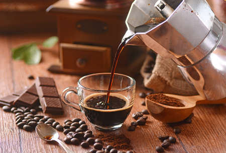 pour coffee into glass cupの写真素材