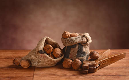 organic walnuts in the bag on the wooden tableの写真素材