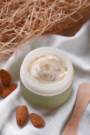 moisturizing body cream with almondsの写真素材