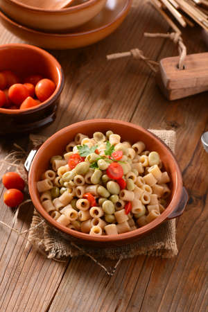 whole wheat pasta with beans and tomatoの写真素材