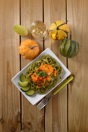 Italian noodles with cream of pumpkin and zucchiniの写真素材