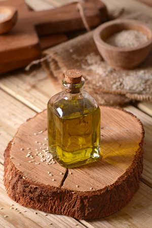 Oil of sesame seeds in the glass bottleの写真素材