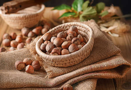 pile of hazelnuts in shell in the trash.の写真素材