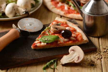 Pizza with champignon mushrooms and black olives - closeupの写真素材