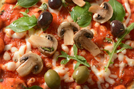 Pizza with champignon mushrooms and black olives - closeupの写真素材
