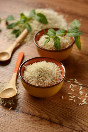 Raw basmati rice in terracotta bowl - closeupの写真素材
