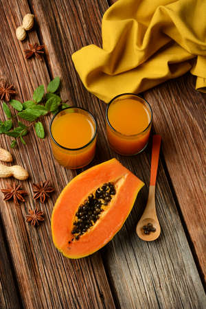 papaya juice on wooden table - closeupの写真素材
