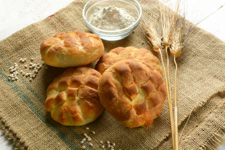 barley flour bread on jute canvas - closeup