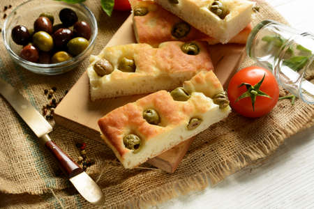 traditional Italian focaccia with olives on the table - closeupの写真素材