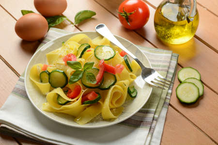 egg pappardelle with zucchini and tomato - closeupの写真素材