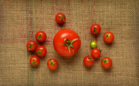 pile of tomatoes on jute canvas - closeupの写真素材