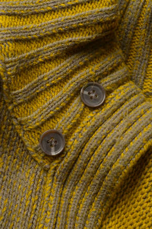 sewing buttons attached to the wool sweater - closeupの写真素材