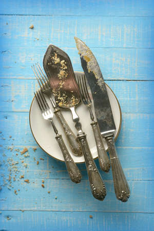 pile of dirty silver cutlery on the table - closeupの写真素材