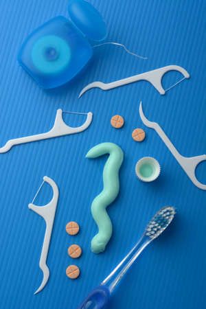 tools for oral hygiene on the light blue background - closeupの写真素材