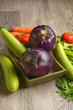 eggplant with other vegetables around - closeupの写真素材