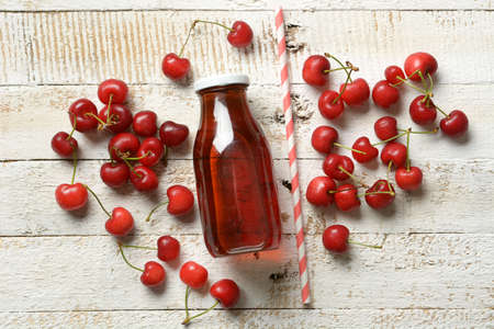 cherry juice on the white table - closeupの写真素材