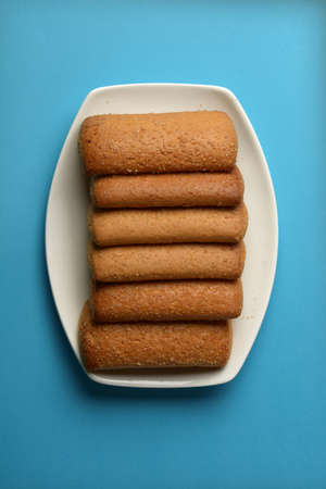 row of shortbread biscuits in white saucer - closeupの写真素材