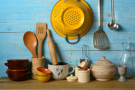 pile of kitchen utensils on light blue background - horizontal - closeupの写真素材