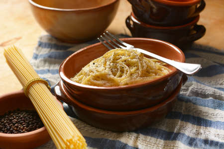 spaghetti with pecorino cheese and pepper - traditional recipe of Roman cuisine - Italian recipe - closeupの写真素材