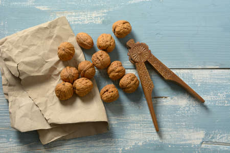 italian walnuts on the colored wooden table - closeupの写真素材