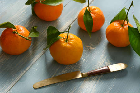 sicilian tangerines on the colored wooden table - closeupの写真素材