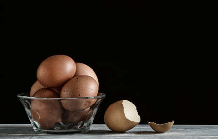 eggs in the glass bowl on the wooden table - closeupの写真素材