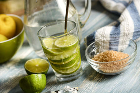 thirst-quenching lime drink with fruit slices in the glass - closeupの写真素材