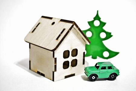 Toy wooden house, tree and car on white backgroundの写真素材