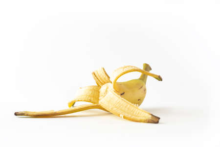 Peeled banana isolated on white background, Yellow fresh banana fruit on white backgroundの写真素材
