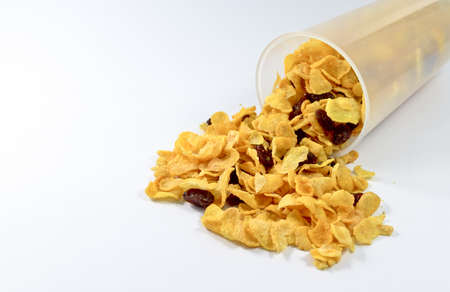 fresh cereal cornflakes with currant on white backgroundの写真素材