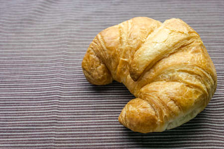 croissant on brown Tableclothの写真素材