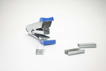 old stappler on paper with staplesの写真素材