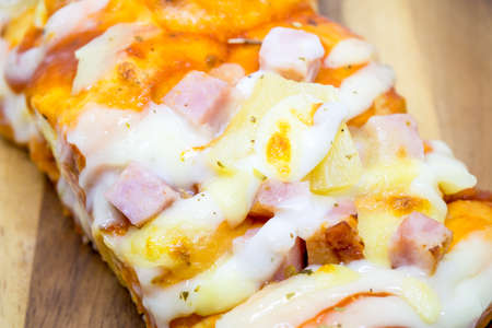 pizza on wooden plateの写真素材