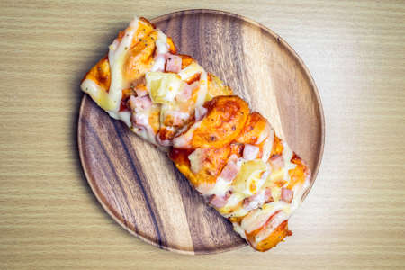 pizza on wooden plateの写真素材