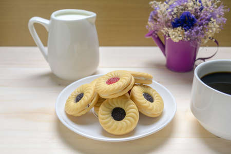 Coffee biscuits and milk over wooden backgroundの写真素材