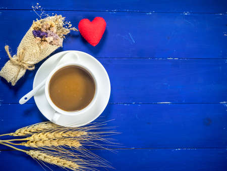 coffee and cookie on blue wooden background with flat lay imageの写真素材
