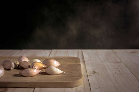 garlic on Chopping board mystic photography and selective focusの写真素材