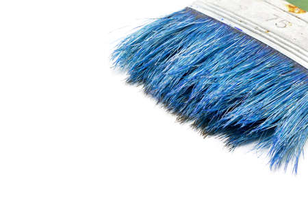 Old paintbrush isolated on white background, close up