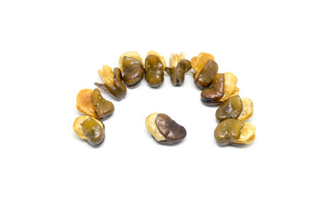 Baked salted broad beans isolated on white backgroundの写真素材