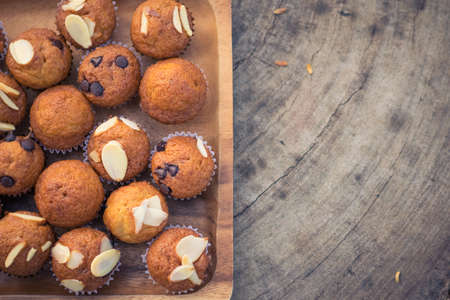 Mini banana muffins on wooden plateの写真素材