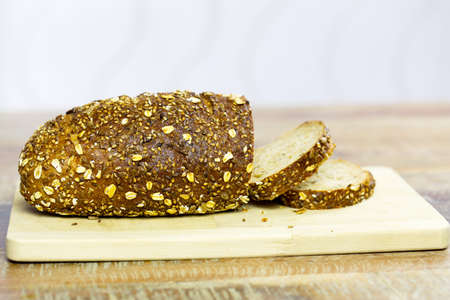 Composition of fresh bread on wood. Blur background