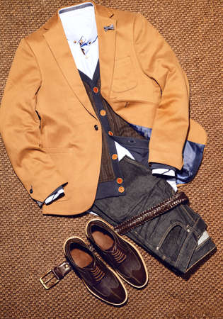 Top view of classic Men's clothes with accessories such as jacket, jeans, shirt, shoes and belt.の写真素材