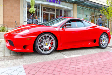 REDMOND, WA - APRIL 29, 2017: Red Ferrari at Exotic car show at Redmond Town Center. The Largest Weekly Gathering Of Exotic Cars In The USA.のeditorial素材