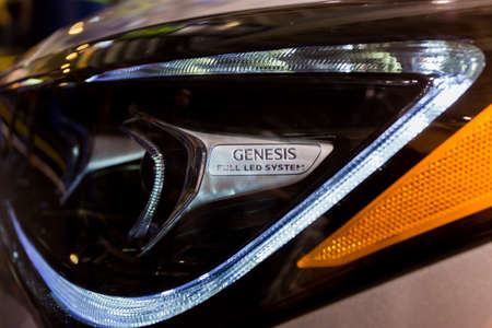 SEATTLE, WA - NOVEMBER 12, 2017: Genesis full led headlights of a white car at Seattle International...