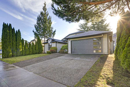 Beautiful curb appeal of a single family home with taupe exterior paint and 1-car garage. 