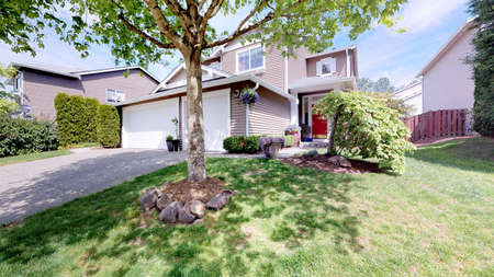 Adorable two story home exterior on a bright sunny day.の写真素材